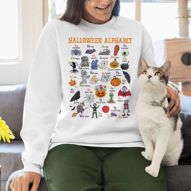 Halloween Alphabet ABCs Learning Kindergarten Teacher Women Crewneck Sweatshirt, gift for family, gift for coworker Halloween Alphabet ABCs Learning Kindergarten Teacher Women Crewneck Sweatshirt, gift for family, gift for coworker