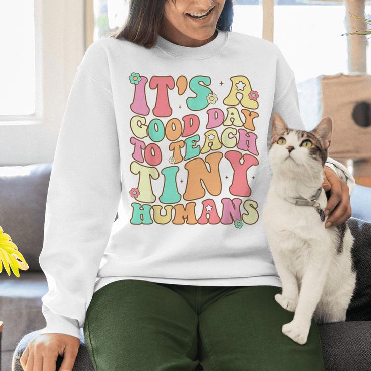 It's A Good Day To Teach Tiny Humans Teacher Teaching Women Crewneck Sweatshirt, gift for family, gift for coworker It's A Good Day To Teach Tiny Humans Teacher Teaching Women Crewneck Sweatshirt, gift for family, gift for coworker