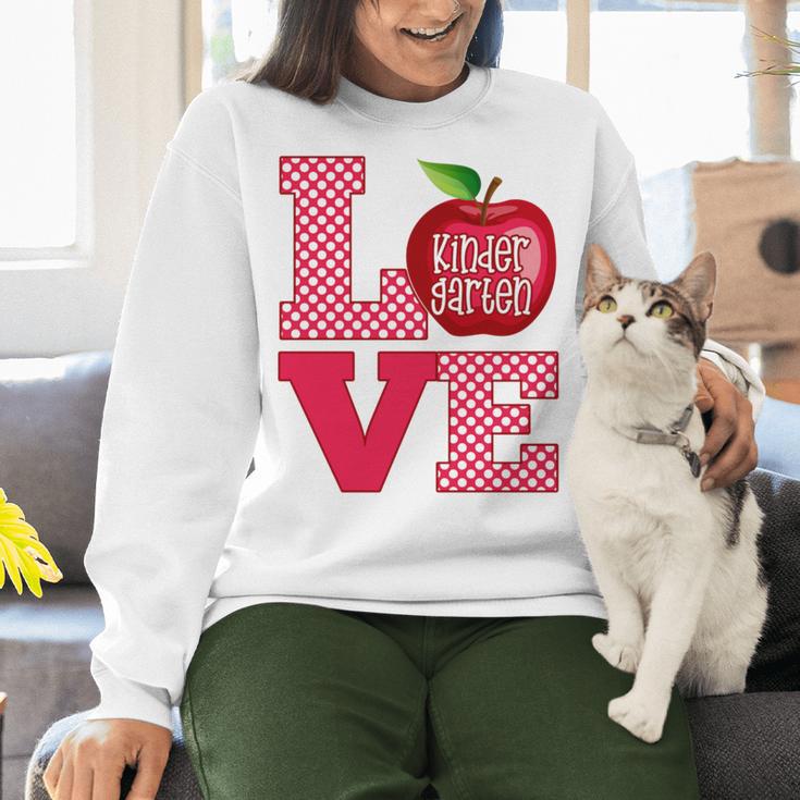Love Kindergarten Cute Apple School Teacher Women Crewneck Sweatshirt, gift for family, gift for coworker Love Kindergarten Cute Apple School Teacher Women Crewneck Sweatshirt, gift for family, gift for coworker