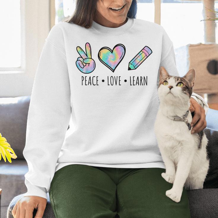 Peace Love Learn Tie Dye Teacher Kids 100th Days Of School Women Crewneck Sweatshirt, gift for family, gift for coworker Peace Love Learn Tie Dye Teacher Kids 100th Days Of School Women Crewneck Sweatshirt, gift for family, gift for coworker
