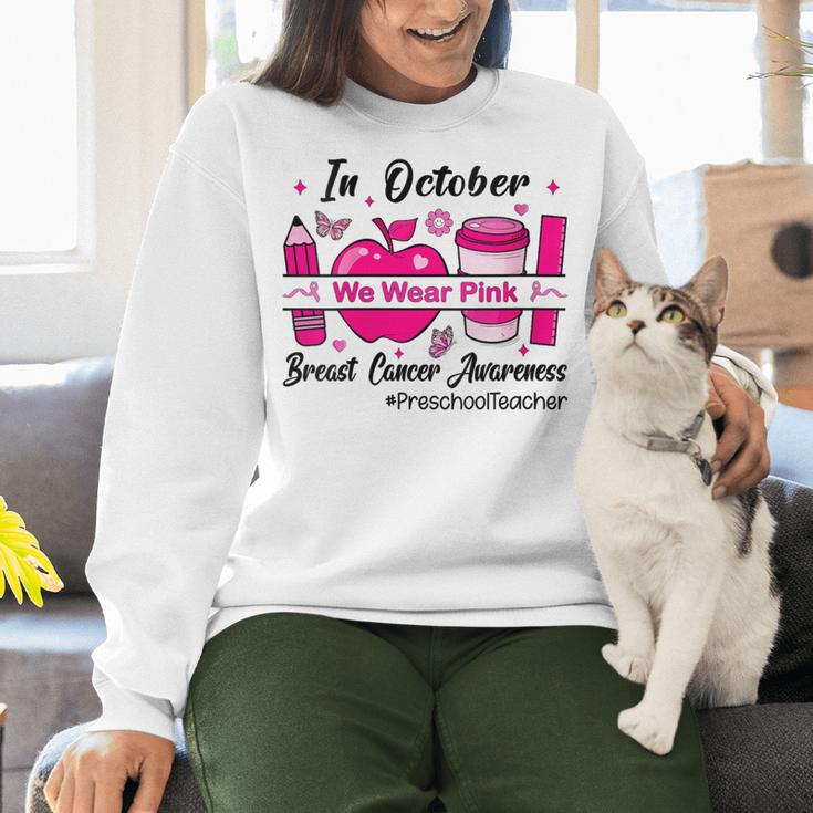 Preschool Teacher In October We Wear Pink Breast Cancer Women Crewneck Sweatshirt, gift for family, gift for coworker