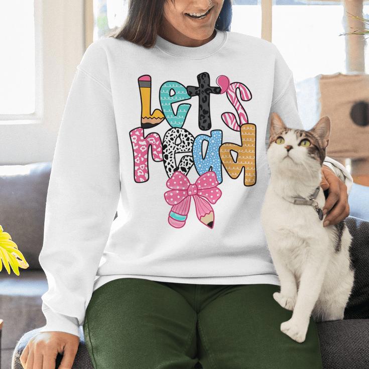 Lets Read Reading Teacher Back To School Literacy Pencil Bow Women Crewneck Sweatshirt, gift for family, gift for coworker