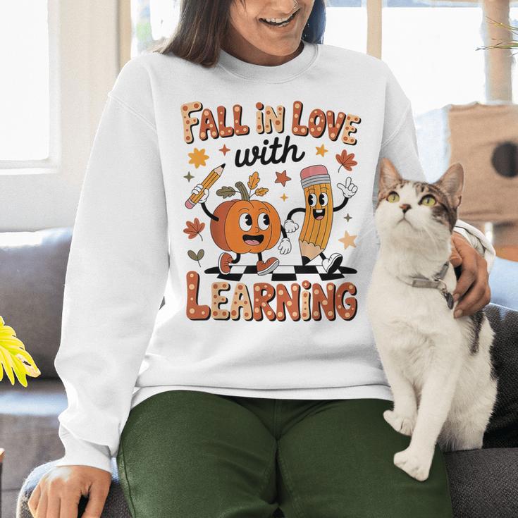 Retro Fall In Love With Learning Autumn Pumpkin Teacher Kids Women Crewneck Sweatshirt, gift for family, gift for coworker Retro Fall In Love With Learning Autumn Pumpkin Teacher Kids Women Crewneck Sweatshirt, gift for family, gift for coworker