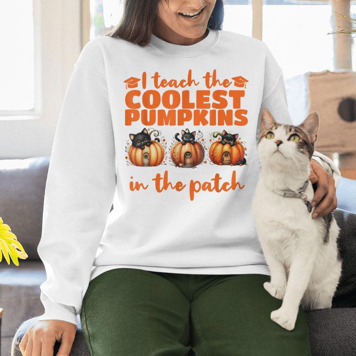I Teach The Cutest Pumpkins Halloween Teacher Cat Lover Women Crewneck Sweatshirt, gift for family, gift for coworker