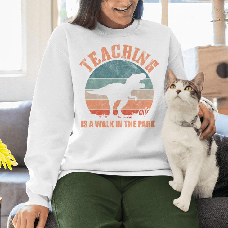 Teaching Is A Walk In The Park Teacher T-Rex Retro Women Crewneck Sweatshirt, gift for family, gift for coworker Teaching Is A Walk In The Park Teacher T-Rex Retro Women Crewneck Sweatshirt, gift for family, gift for coworker