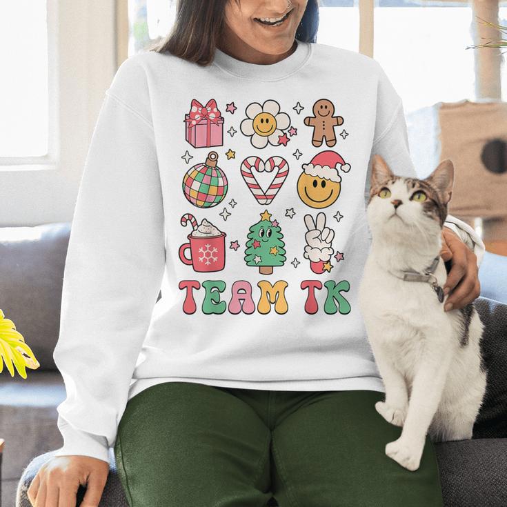 Team TK Teacher Christmas Groovy Smile Face Girl Boy Kid TK Women Crewneck Sweatshirt, Groovy Teacher Sweatshirts, gift for family, gift for coworker Team TK Teacher Christmas Groovy Smile Face Girl Boy Kid TK Women Crewneck Sweatshirt, Groovy Teacher Sweatshirts, gift for family, gift for coworker