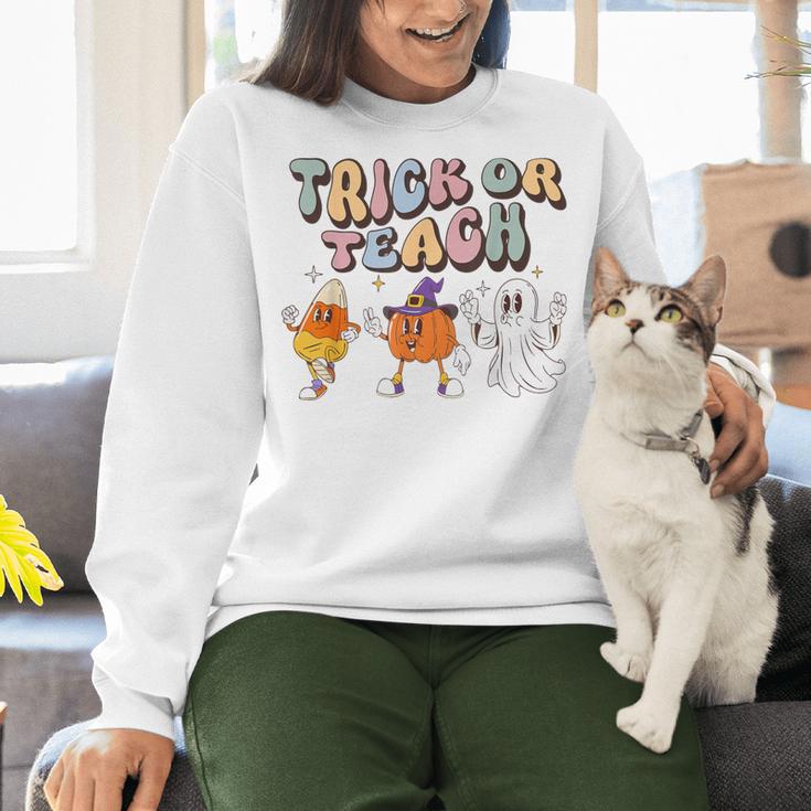 Trick Or Teach Candy Corn Pumpkin Ghost Teacher Women Crewneck Sweatshirt, gift for family, gift for coworker