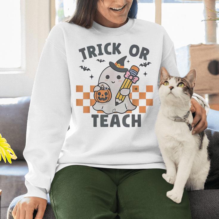Trick Or Teach Teacher Women Crewneck Sweatshirt, gift for family, gift for coworker Trick Or Teach Teacher Women Crewneck Sweatshirt, gift for family, gift for coworker