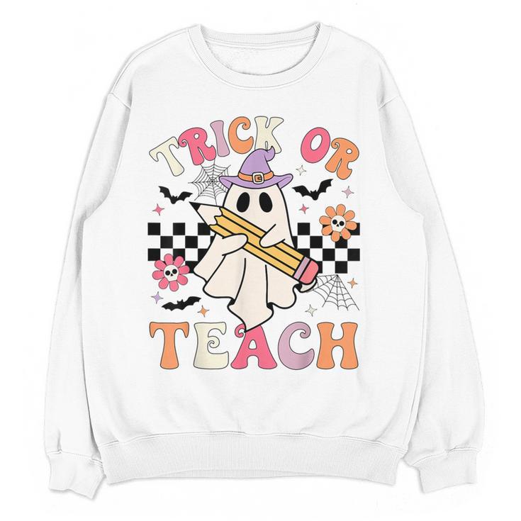 Trick Or Teach Groovy Teacher Halloween Retro Floral Ghost Women Crewneck Sweatshirt, novelty gifts, funny gifts