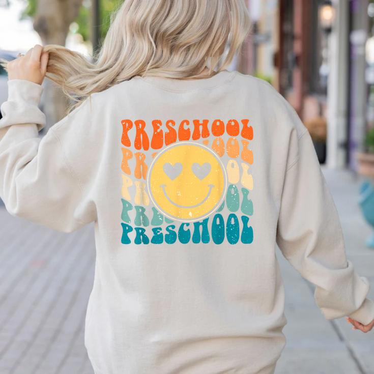 Back To School Groovy Smile Preschool Teachers Students Kids Women's Sweatshirt Back Print