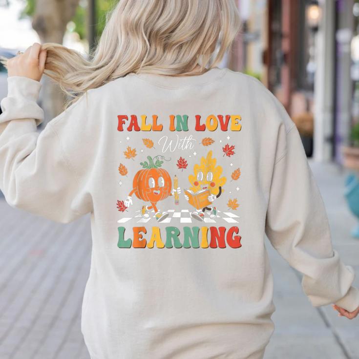 Groovy Fall In Love With Learning Autumn Pumpkin Teacher Women's Sweatshirt Back Print