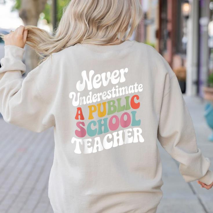 Never Underestimate a Public School Teacher Public Education Women's Sweatshirt Back Print