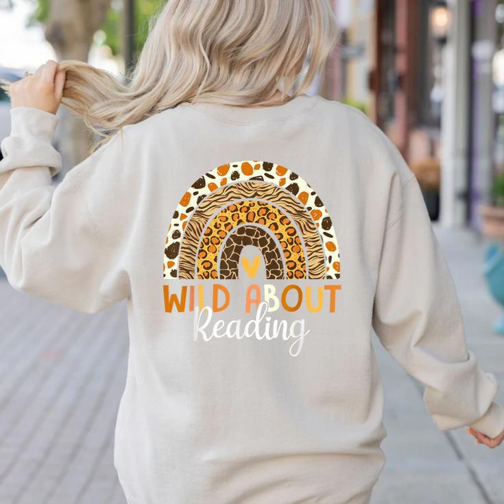 Wild About Reading Teacher Back To School Leopard Rainbow Women's Sweatshirt Back Print