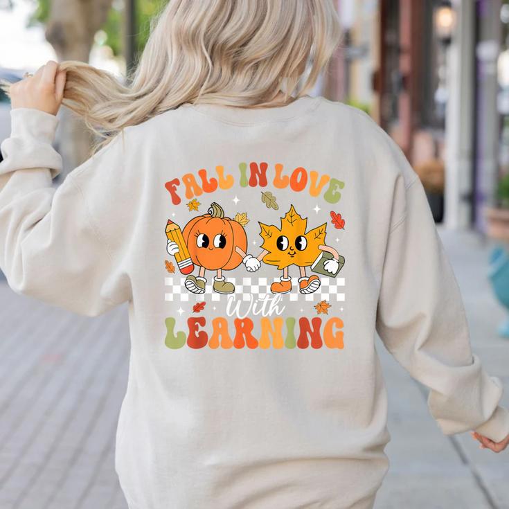 Retro Pumpkin Fall In Love With Learning Autumn Teacher Women's Sweatshirt Back Print