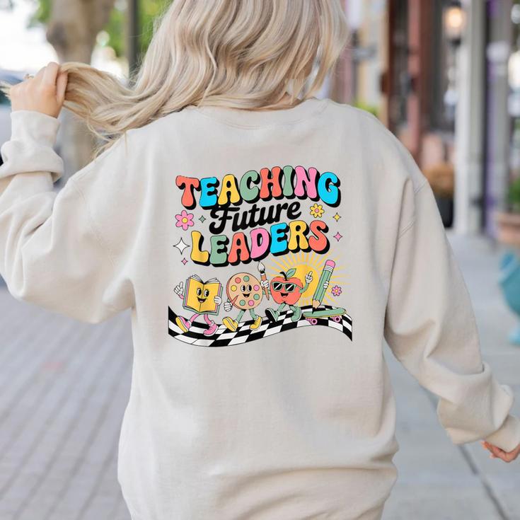 Retro Teaching Future Leaders Groovy Teacher Back To School Women's Sweatshirt Back Print
