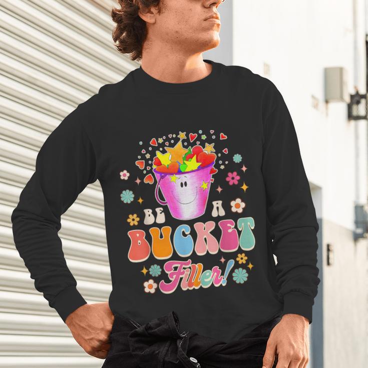 Be A Bucket Filler Teacher Teaching Groovy Back To School For Men Women Unisex Long Sleeve T-Shirt, gift for family, gift for coworker Be A Bucket Filler Teacher Teaching Groovy Back To School For Men Women Unisex Long Sleeve T-Shirt, gift for family, gift for coworker