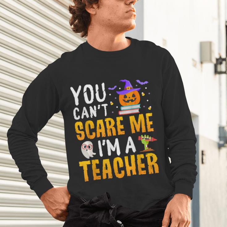 You Cant Scare Me Im A Teacher Halloween Trick Or Teach 2024 Unisex Long Sleeve T-Shirt, gift for family, gift for coworker You Cant Scare Me Im A Teacher Halloween Trick Or Teach 2024 Unisex Long Sleeve T-Shirt, gift for family, gift for coworker