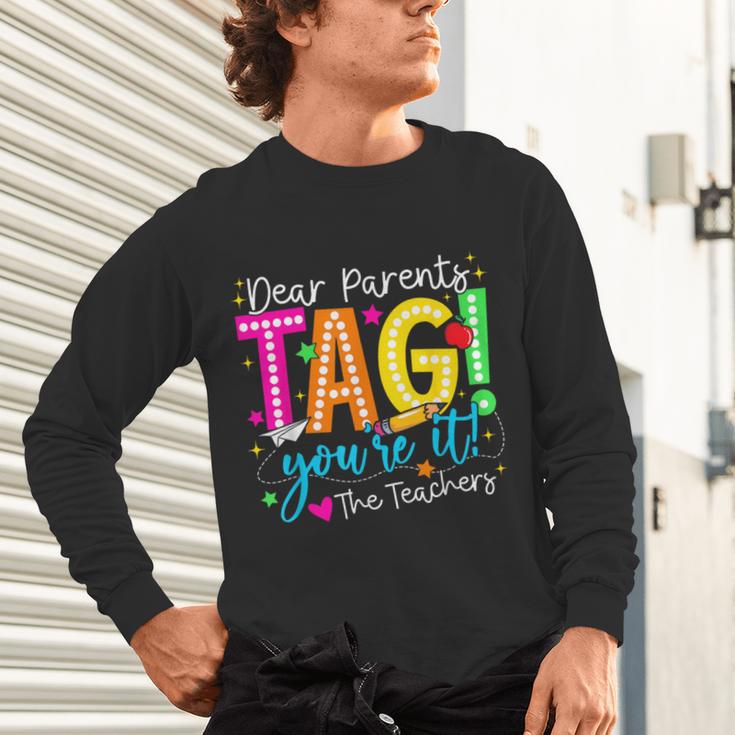 Dear Parents Tag You'Re It Love Teachers Last Day Of School Unisex Long Sleeve T-Shirt, gift for family, gift for coworker Dear Parents Tag You'Re It Love Teachers Last Day Of School Unisex Long Sleeve T-Shirt, gift for family, gift for coworker