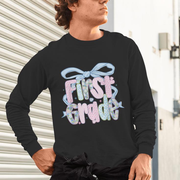 First Grade Coquette Bow Girls Teacher Team 1st Grade Squad Unisex Long Sleeve T-Shirt, gift for family, gift for coworker