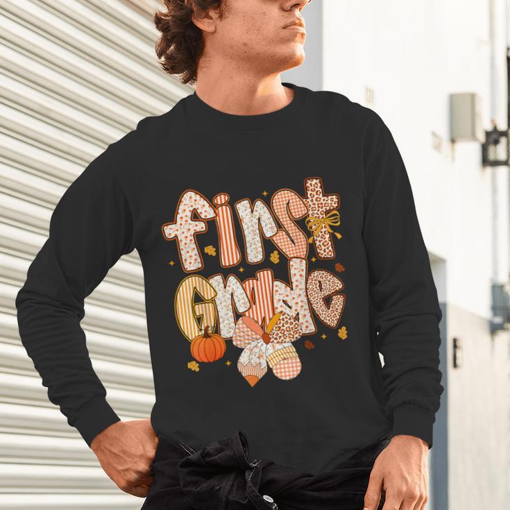 First Grade Fall Floral Coquette Bow Teachers Students Unisex Long Sleeve T-Shirt, gift for family, gift for coworker First Grade Fall Floral Coquette Bow Teachers Students Unisex Long Sleeve T-Shirt, gift for family, gift for coworker