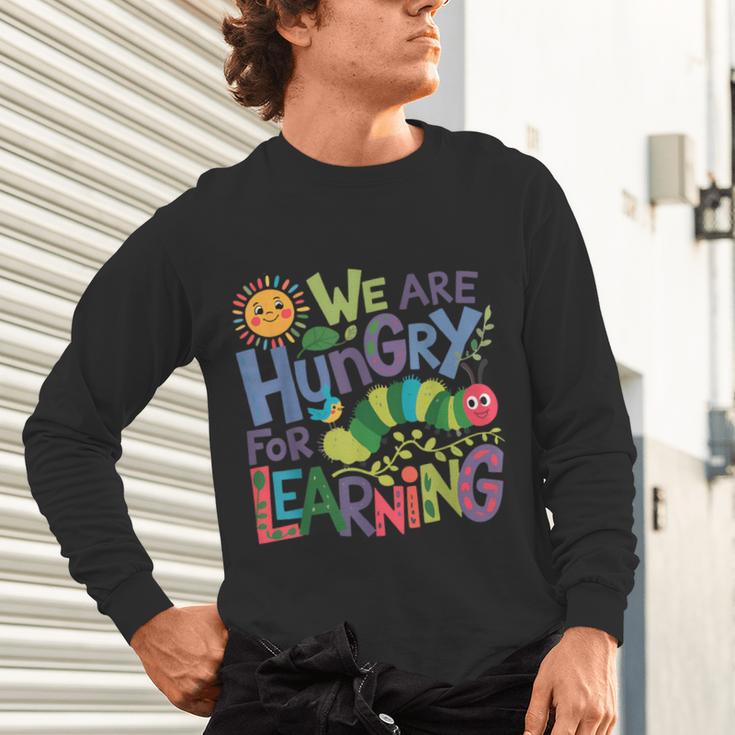 We Are Hungry For Learning Teacher Life Back To School Unisex Long Sleeve T-Shirt, gift for family, gift for coworker We Are Hungry For Learning Teacher Life Back To School Unisex Long Sleeve T-Shirt, gift for family, gift for coworker