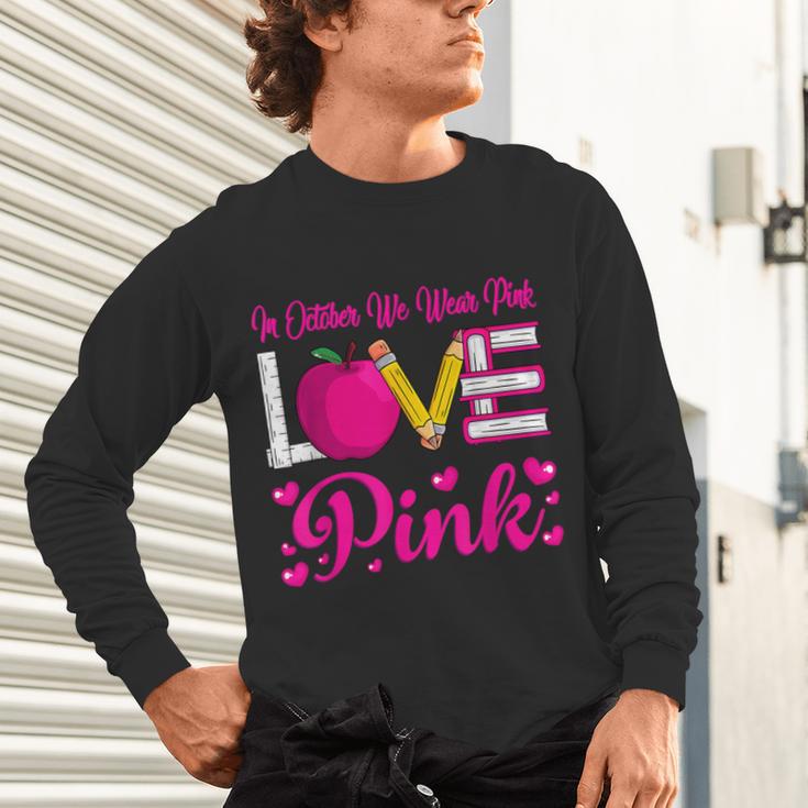 In October We Wear Pink Love Teacher Breast Cancer Awareness Unisex Long Sleeve T-Shirt, gift for family, gift for coworker In October We Wear Pink Love Teacher Breast Cancer Awareness Unisex Long Sleeve T-Shirt, gift for family, gift for coworker