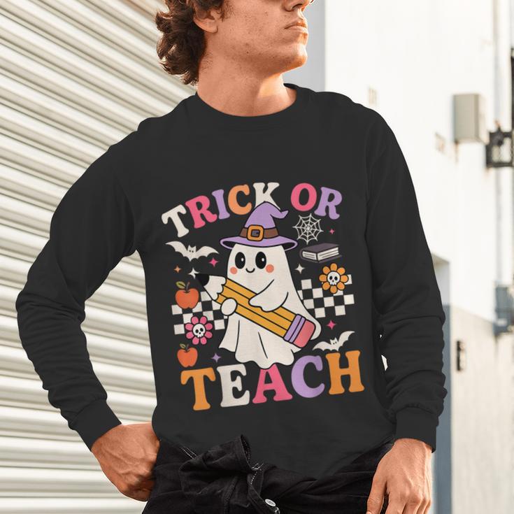 Retro Floral Ghost Trick Or Teach Groovy Teacher Halloween Unisex Long Sleeve T-Shirt, gift for family, gift for coworker Retro Floral Ghost Trick Or Teach Groovy Teacher Halloween Unisex Long Sleeve T-Shirt, gift for family, gift for coworker