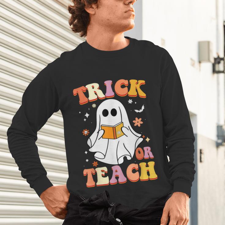 Retro Vintage Groovy Trick Or Teach Teacher Halloween For Men Women Kids Unisex Long Sleeve T-Shirt, gift for family, gift for coworker Retro Vintage Groovy Trick Or Teach Teacher Halloween For Men Women Kids Unisex Long Sleeve T-Shirt, gift for family, gift for coworker
