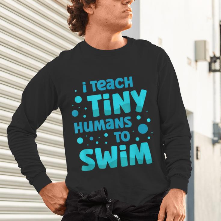 Swimming Teacher I Teach Tiny Humans To Swim Swim Instructor Unisex Long Sleeve T-Shirt, gift for family, gift for coworker Swimming Teacher I Teach Tiny Humans To Swim Swim Instructor Unisex Long Sleeve T-Shirt, gift for family, gift for coworker