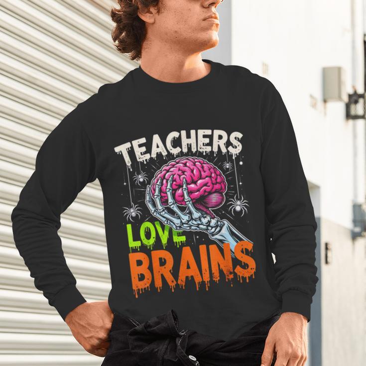 Teachers Love Brains Halloween 2025 Skeleton Costume Unisex Long Sleeve T-Shirt, gift for family, gift for coworker Teachers Love Brains Halloween 2025 Skeleton Costume Unisex Long Sleeve T-Shirt, gift for family, gift for coworker