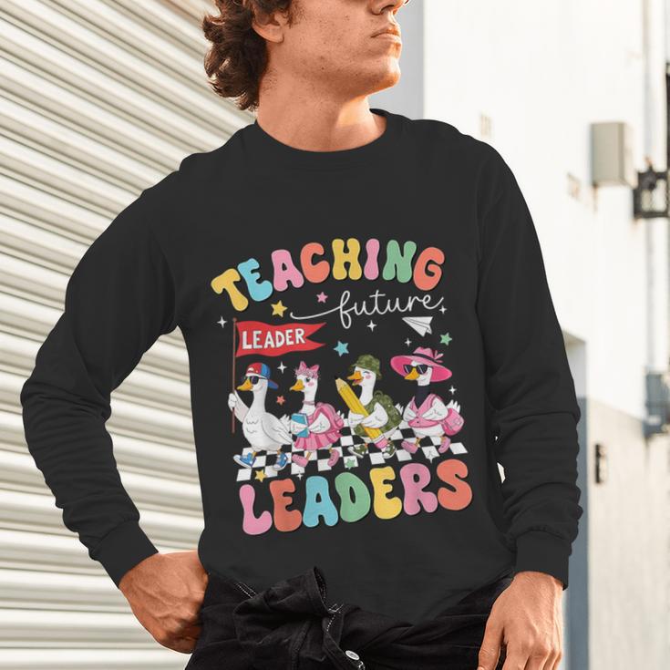 Teaching Future Leaders Groovy Teacher Back To School Unisex Long Sleeve T-Shirt, gift for family, gift for coworker