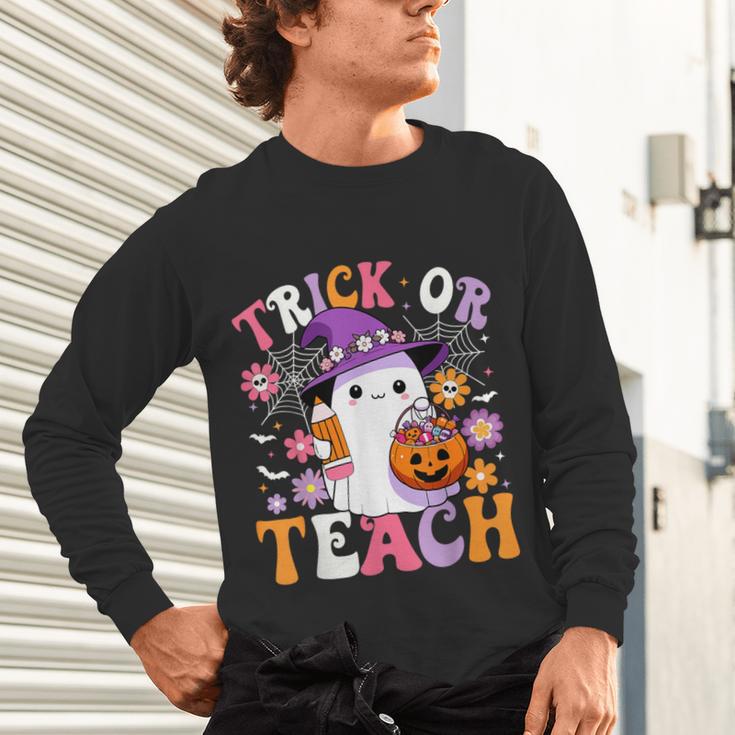 Trick Or Teach Groovy Teacher Ghost Halloween Teacher Unisex Long Sleeve T-Shirt, gift for family, gift for coworker