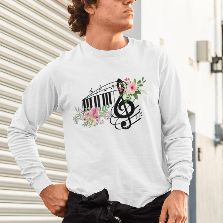 Cut Music Teacher Shirt With a Piano Keys Notes And Flowers Unisex Long Sleeve T-Shirt, gift for family, gift for coworker Cut Music Teacher Shirt With a Piano Keys Notes And Flowers Unisex Long Sleeve T-Shirt, gift for family, gift for coworker