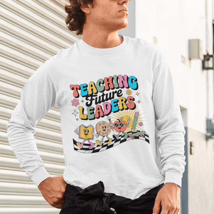 Retro Teaching Future Leaders Groovy Teacher Back To School Unisex Long Sleeve T-Shirt, gift for family, gift for coworker Retro Teaching Future Leaders Groovy Teacher Back To School Unisex Long Sleeve T-Shirt, gift for family, gift for coworker