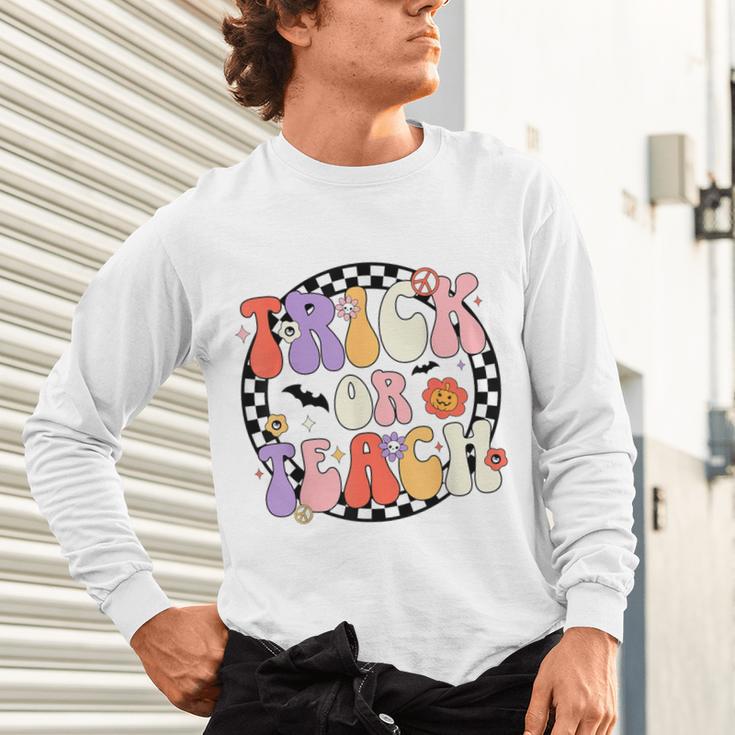 Trick Or Teach Retro Groovy Halloween Teacher Unisex Long Sleeve T-Shirt, gift for family, gift for coworker Trick Or Teach Retro Groovy Halloween Teacher Unisex Long Sleeve T-Shirt, gift for family, gift for coworker
