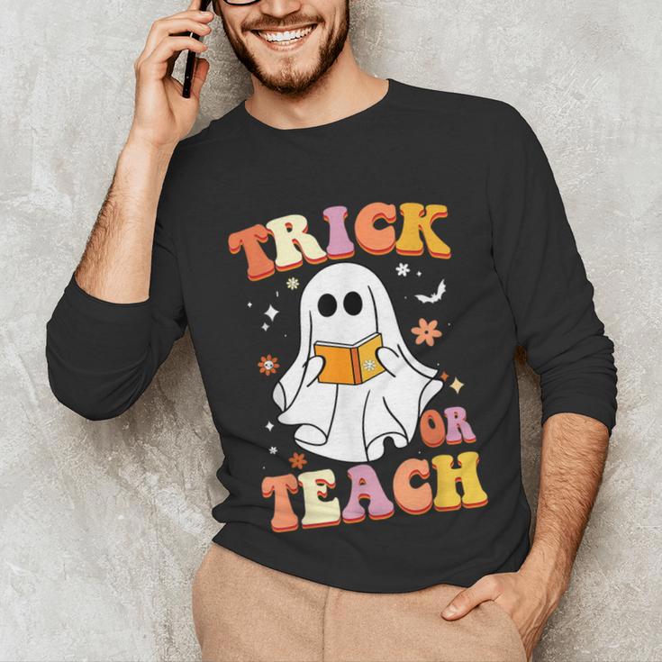 Retro Vintage Groovy Trick Or Teach Teacher Halloween For Men Women Kids Unisex Long Sleeve T-Shirt, funny gift Retro Vintage Groovy Trick Or Teach Teacher Halloween For Men Women Kids Unisex Long Sleeve T-Shirt, funny gift