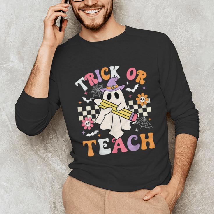 Trick Or Teach Groovy Teacher Halloween Retro Teacher Ghost Unisex Long Sleeve T-Shirt, funny gift Trick Or Teach Groovy Teacher Halloween Retro Teacher Ghost Unisex Long Sleeve T-Shirt, funny gift
