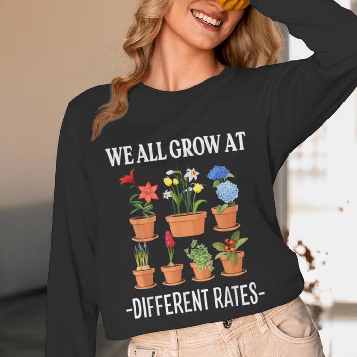We All Grow At Different Rates Back To School Teacher Unisex Long Sleeve T-Shirt, funny design