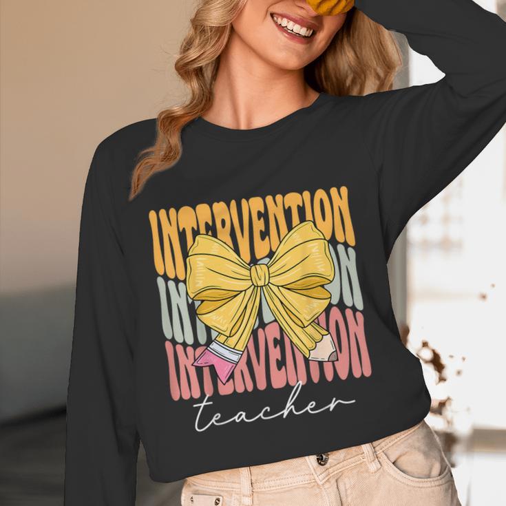 Interventionist Teacher Groovy Coquette Bow Back To School Unisex Long Sleeve T-Shirt, funny design Interventionist Teacher Groovy Coquette Bow Back To School Unisex Long Sleeve T-Shirt, funny design