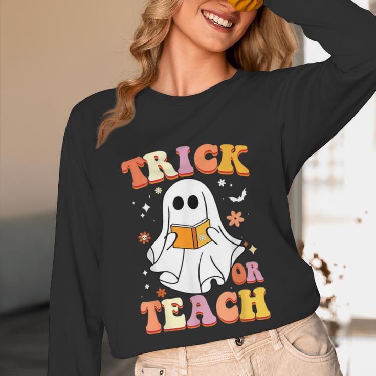 Retro Vintage Groovy Trick Or Teach Teacher Halloween For Men Women Kids Unisex Long Sleeve T-Shirt, funny design Retro Vintage Groovy Trick Or Teach Teacher Halloween For Men Women Kids Unisex Long Sleeve T-Shirt, funny design