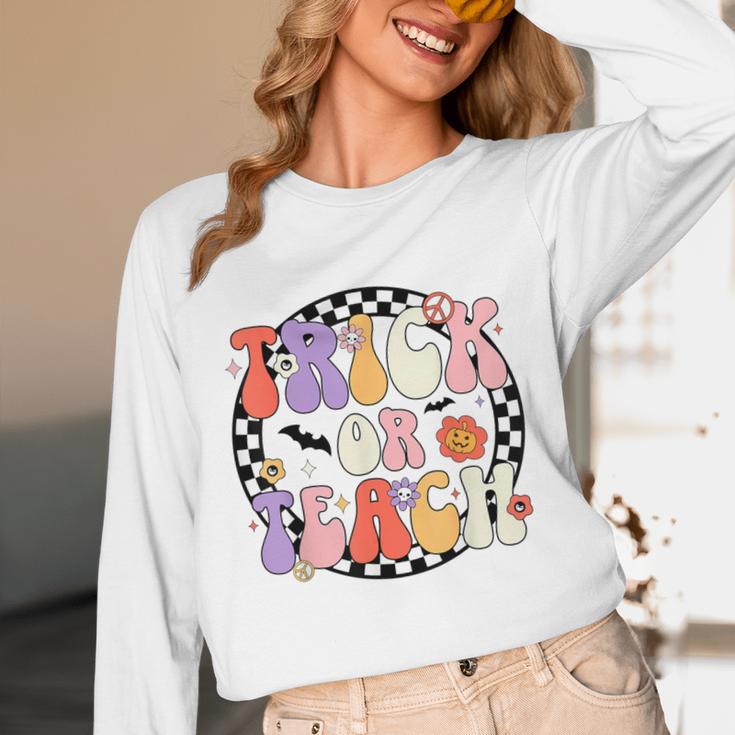 Trick Or Teach Retro Groovy Halloween Teacher Unisex Long Sleeve T-Shirt, funny design Trick Or Teach Retro Groovy Halloween Teacher Unisex Long Sleeve T-Shirt, funny design