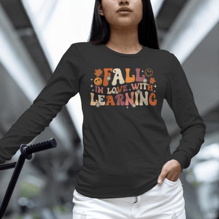 Fall In Love With Learning Autum Thanksgiving Teacher Kids Unisex Long Sleeve T-Shirt, novelty gifts, funny gifts