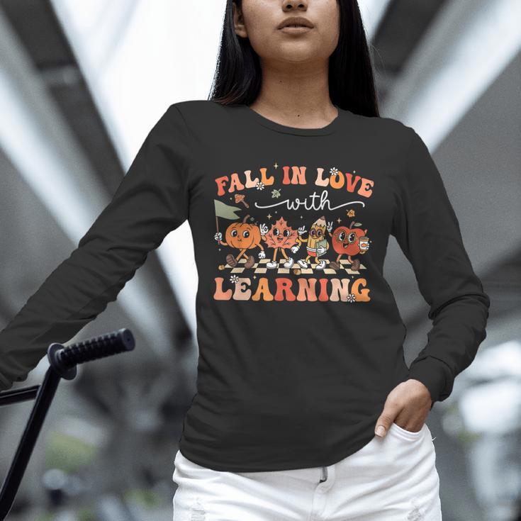 Fall In Love With Learning Autumn Teacher Thanksgiving Unisex Long Sleeve T-Shirt, novelty gifts, funny gifts Fall In Love With Learning Autumn Teacher Thanksgiving Unisex Long Sleeve T-Shirt, novelty gifts, funny gifts