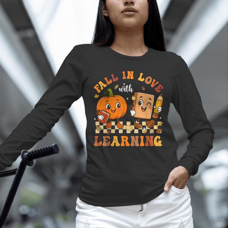 Fall In Love With Reading Book Autumn Pumpkins And Teachers Unisex Long Sleeve T-Shirt, novelty gifts, funny gifts