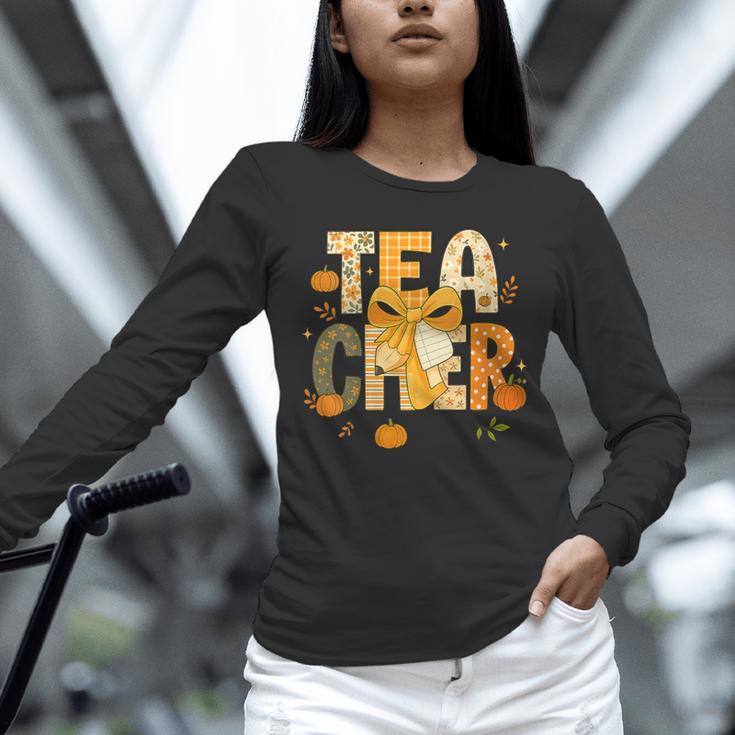 Fall Teacher Pumpkin Coquette Bow Autumn Classroom Unisex Long Sleeve T-Shirt, novelty gifts, funny gifts Fall Teacher Pumpkin Coquette Bow Autumn Classroom Unisex Long Sleeve T-Shirt, novelty gifts, funny gifts