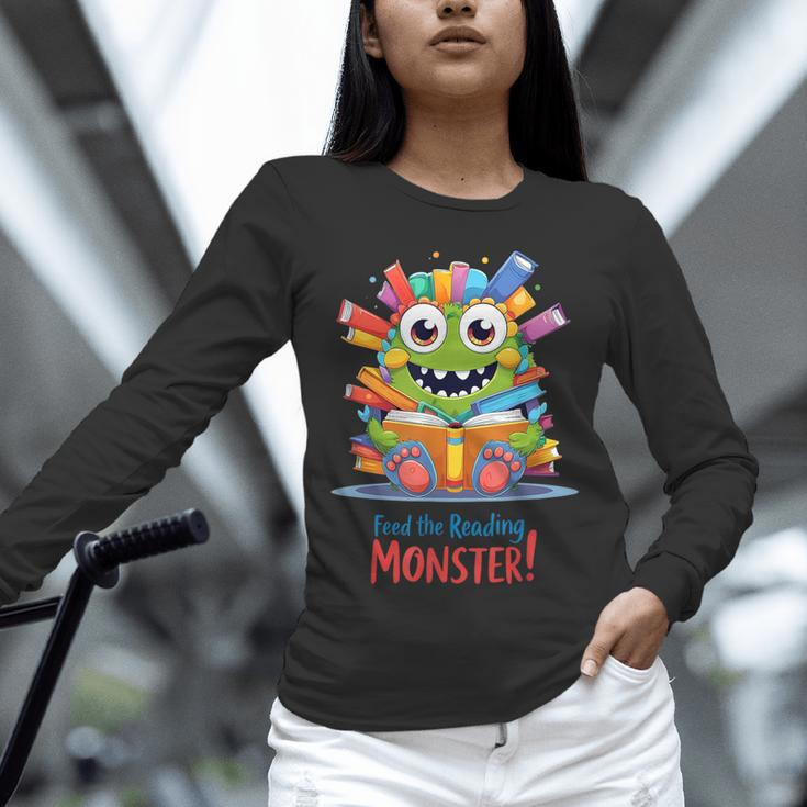Feed The Reading Monster Halloween Teacher Unisex Long Sleeve T-Shirt, novelty gifts, funny gifts Feed The Reading Monster Halloween Teacher Unisex Long Sleeve T-Shirt, novelty gifts, funny gifts
