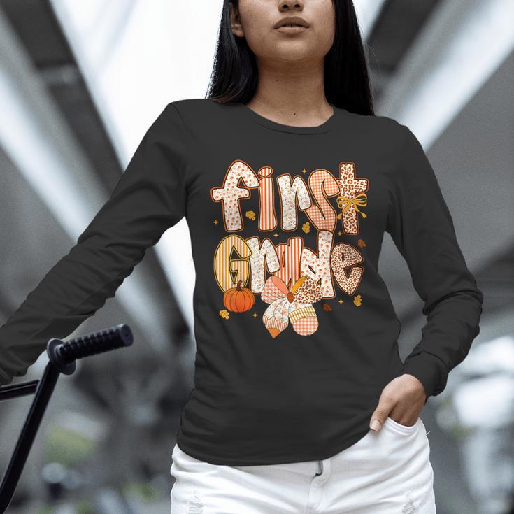 First Grade Fall Floral Coquette Bow Teachers Students Unisex Long Sleeve T-Shirt, novelty gifts, funny gifts First Grade Fall Floral Coquette Bow Teachers Students Unisex Long Sleeve T-Shirt, novelty gifts, funny gifts