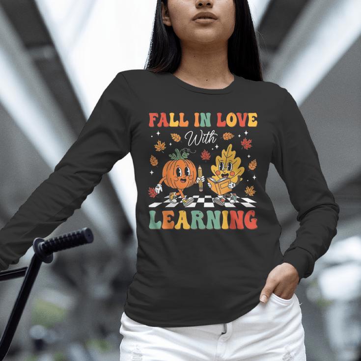 Groovy Fall In Love With Learning Autumn Pumpkin Teacher Unisex Long Sleeve T-Shirt, novelty gifts, funny gifts Groovy Fall In Love With Learning Autumn Pumpkin Teacher Unisex Long Sleeve T-Shirt, novelty gifts, funny gifts
