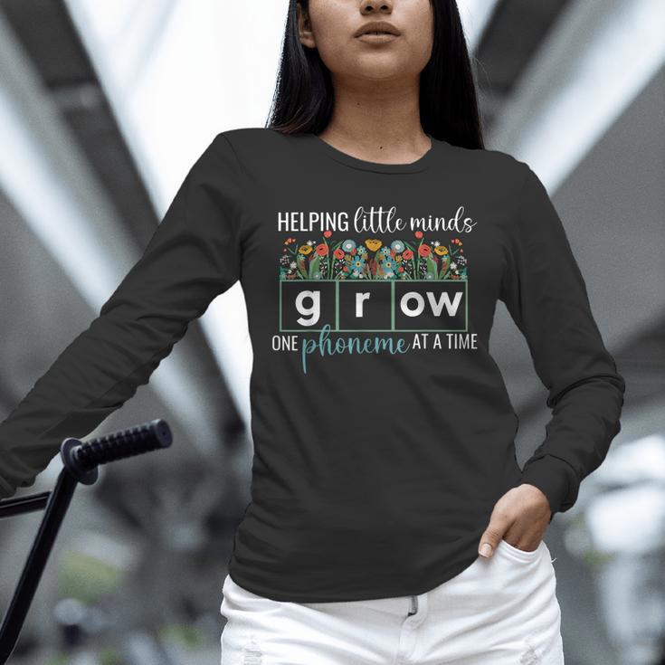 Helping Little Minds Grow One Phoneme At A Time Teacher Unisex Long Sleeve T-Shirt, novelty gifts, funny gifts Helping Little Minds Grow One Phoneme At A Time Teacher Unisex Long Sleeve T-Shirt, novelty gifts, funny gifts