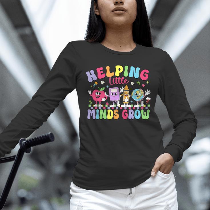 Helping Little Minds Grow Teacher Life Back To School Unisex Long Sleeve T-Shirt, novelty gifts, funny gifts Helping Little Minds Grow Teacher Life Back To School Unisex Long Sleeve T-Shirt, novelty gifts, funny gifts